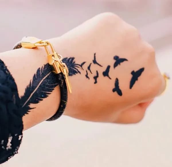 50 Beautiful Feather Tattoo Designs