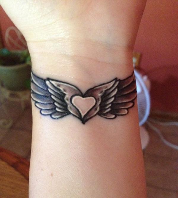 35 Breathtaking Wings Tattoo Designs