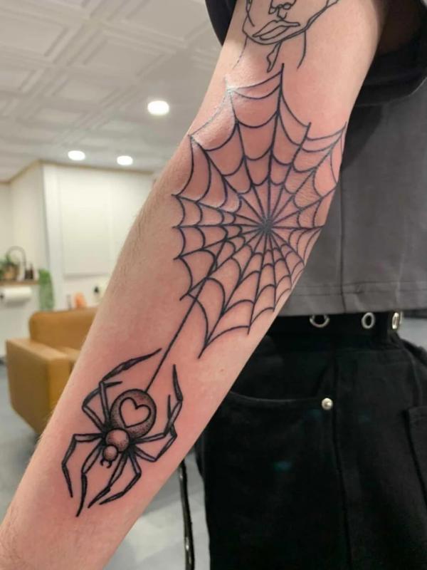 Spider Web Tattoos: Unraveling the Intricate Symbolism