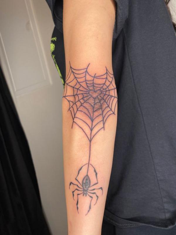 Spider Web Tattoos: Unraveling the Intricate Symbolism