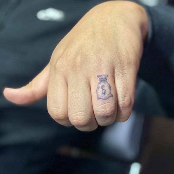 Money Bag Tattoos: Wealth, Ambition, and Artistry