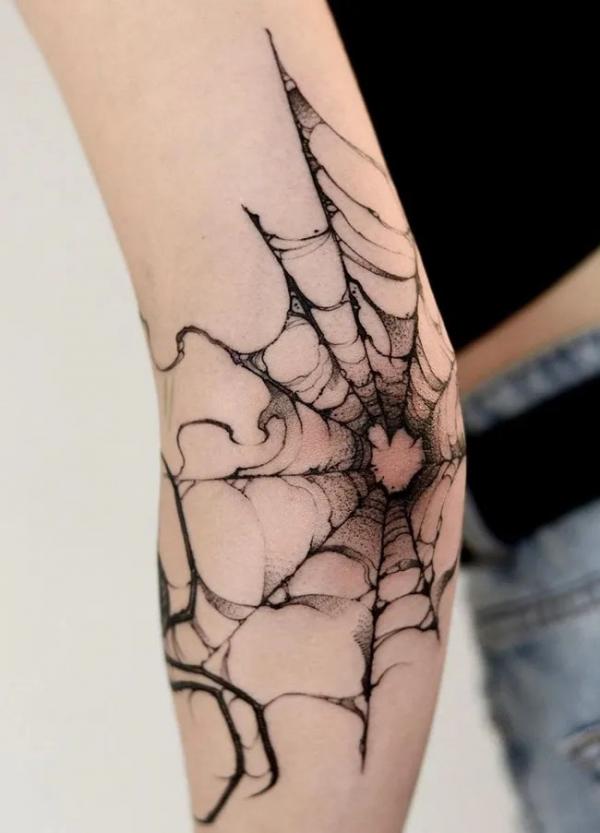Spider Tattoos: Unraveling the Threads of Meaning