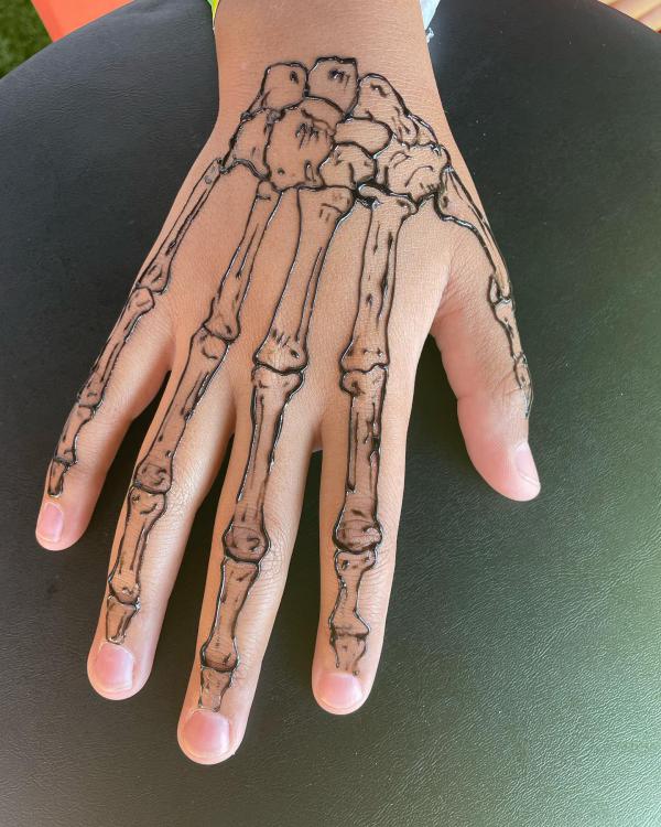 60 Skeleton Hand Tattoo Ideas with Meaning