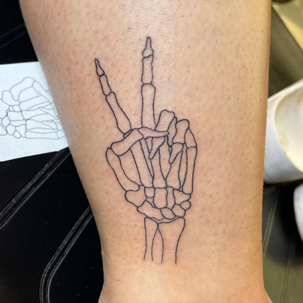 60 Skeleton Hand Tattoo Ideas with Meaning