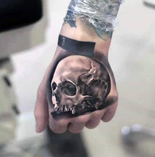 50 Skull Hand Tattoo Designs with Meaning