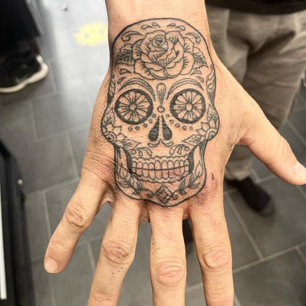 50 Skull Hand Tattoo Designs with Meaning