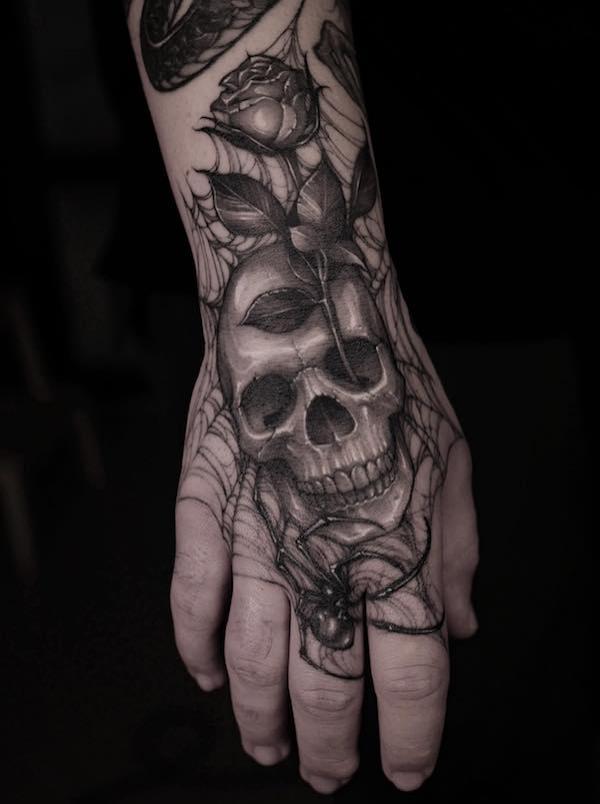 50 Skull Hand Tattoo Designs with Meaning