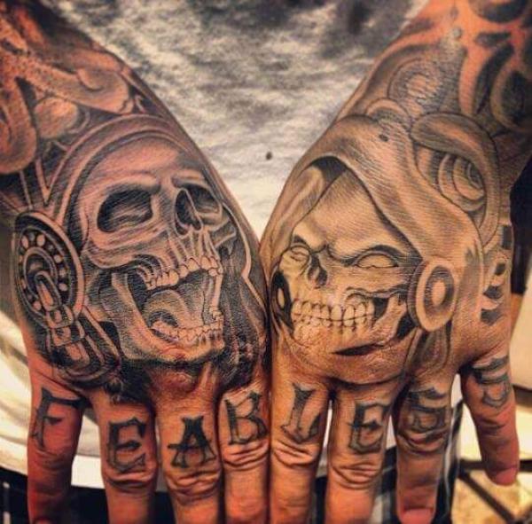 50 Skull Hand Tattoo Designs with Meaning