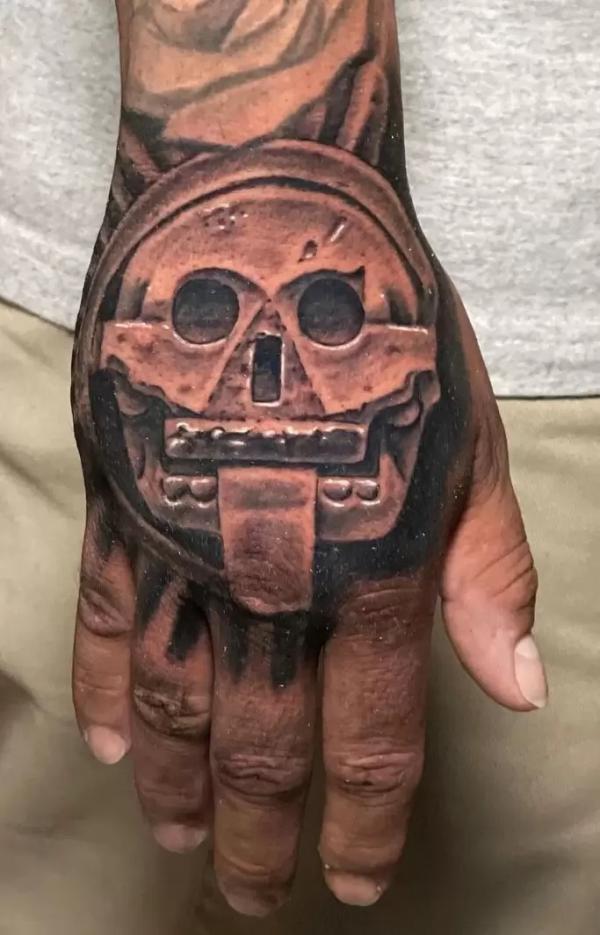50 Skull Hand Tattoo Designs with Meaning