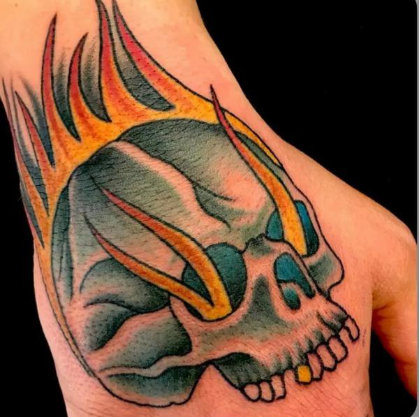 50 Skull Hand Tattoo Designs with Meaning
