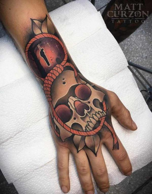 50 Skull Hand Tattoo Designs with Meaning