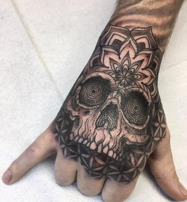 50 Skull Hand Tattoo Designs with Meaning