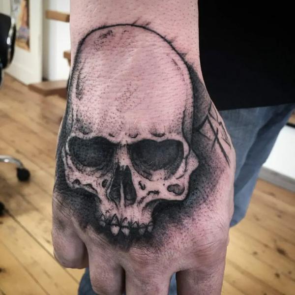 50 Skull Hand Tattoo Designs with Meaning