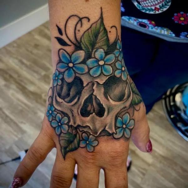50 Skull Hand Tattoo Designs with Meaning