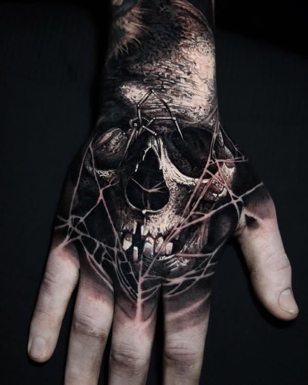 50 Skull Hand Tattoo Designs with Meaning