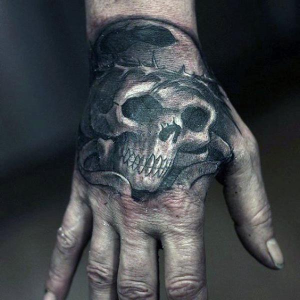 50 Skull Hand Tattoo Designs with Meaning