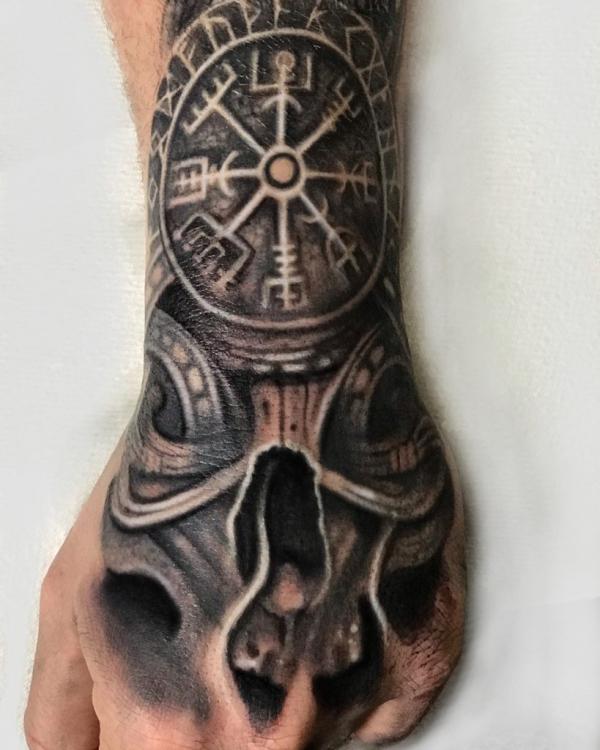50 Skull Hand Tattoo Designs with Meaning