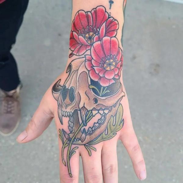 50 Skull Hand Tattoo Designs with Meaning