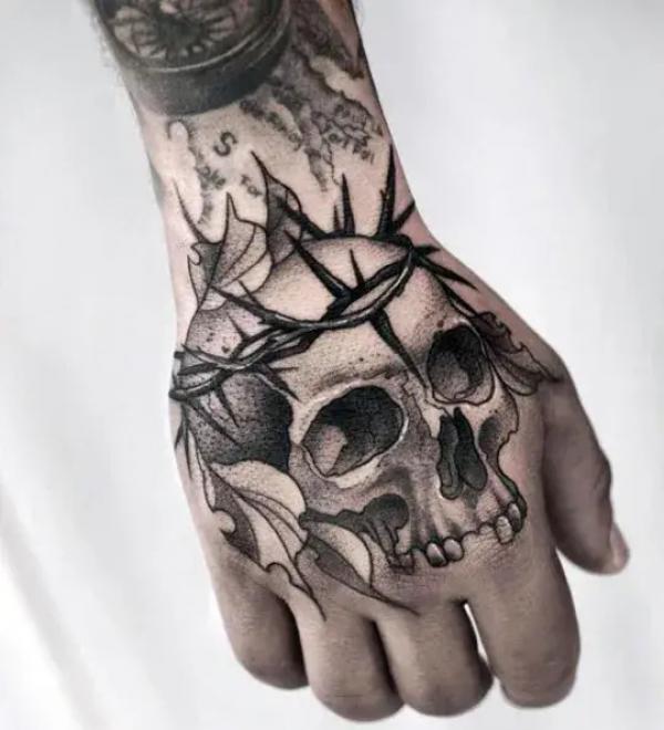 50 Skull Hand Tattoo Designs with Meaning