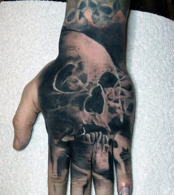 50 Skull Hand Tattoo Designs with Meaning