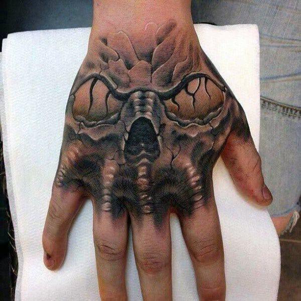 50 Skull Hand Tattoo Designs with Meaning