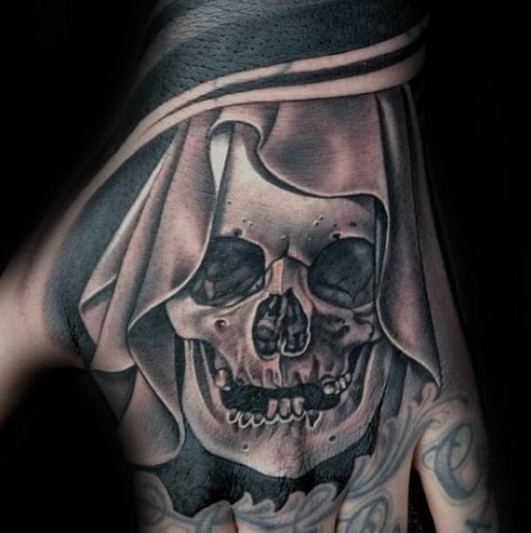 50 Skull Hand Tattoo Designs with Meaning