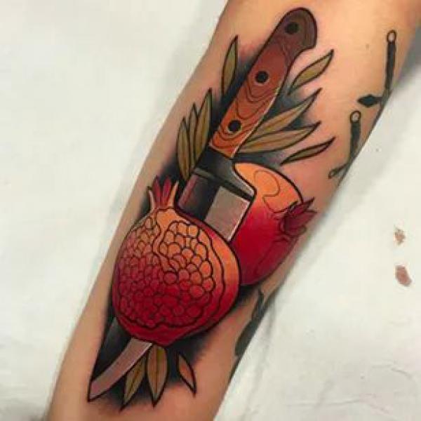 Pomegranate Tattoo: Exploring Its Symbolism and Designs