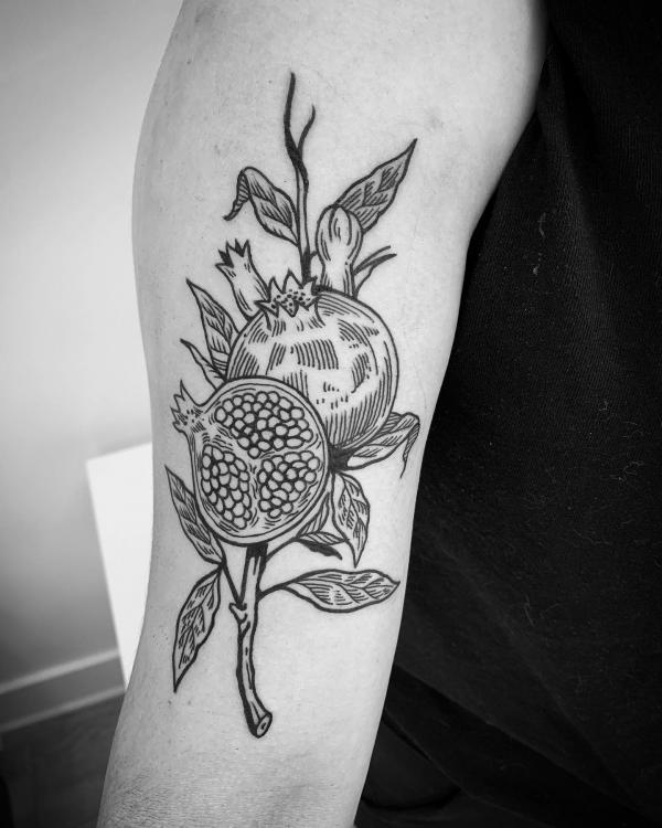 Pomegranate Tattoo: Exploring Its Symbolism and Designs