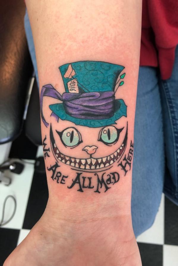 Cheshire Cat Tattoo Designs: A Journey into Wonderland