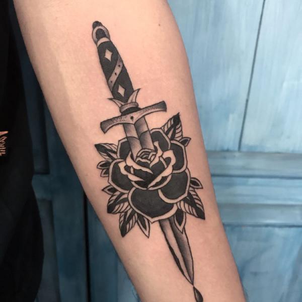 80 Rose and Dagger Tattoo Designs: A Blend of Beauty and Edge