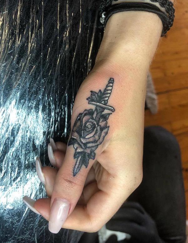 80 Rose and Dagger Tattoo Designs: A Blend of Beauty and Edge