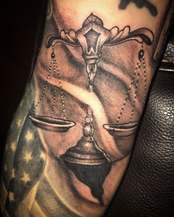 The Scales of Justice Tattoo: Balancing Ink and Ideals