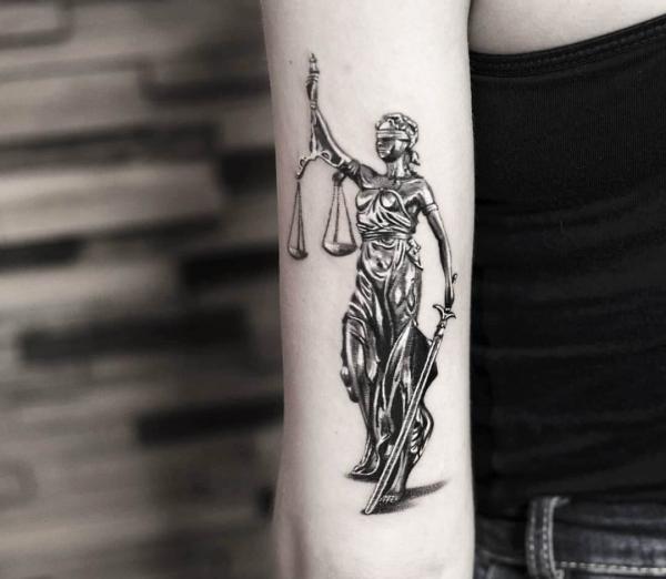 The Scales of Justice Tattoo: Balancing Ink and Ideals