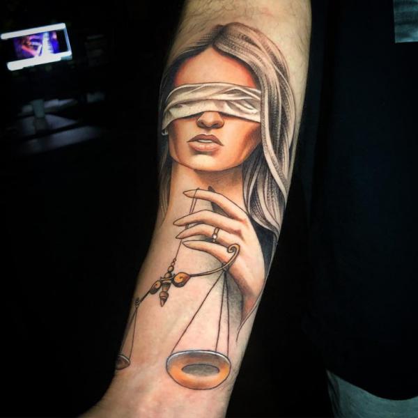 The Scales of Justice Tattoo: Balancing Ink and Ideals