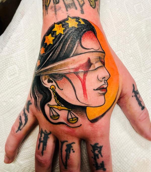 The Scales of Justice Tattoo: Balancing Ink and Ideals