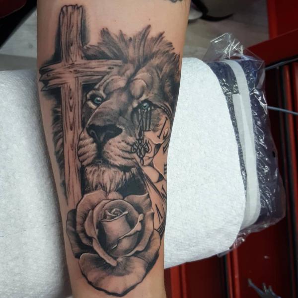 The Majestic Blend: Cross with Lion Tattoos