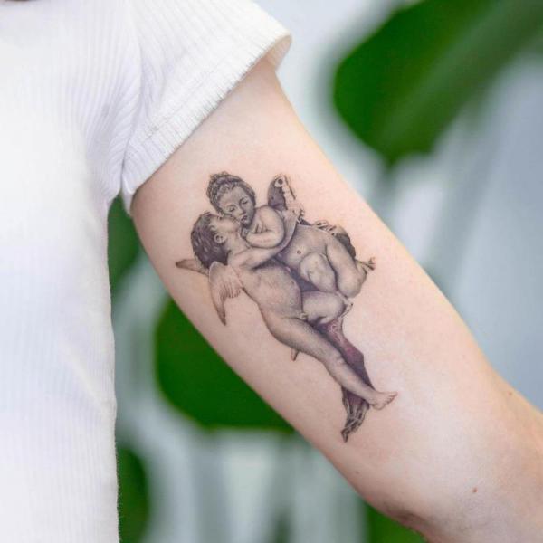 20 Cupid Tattoo Designs That Celebrate Love